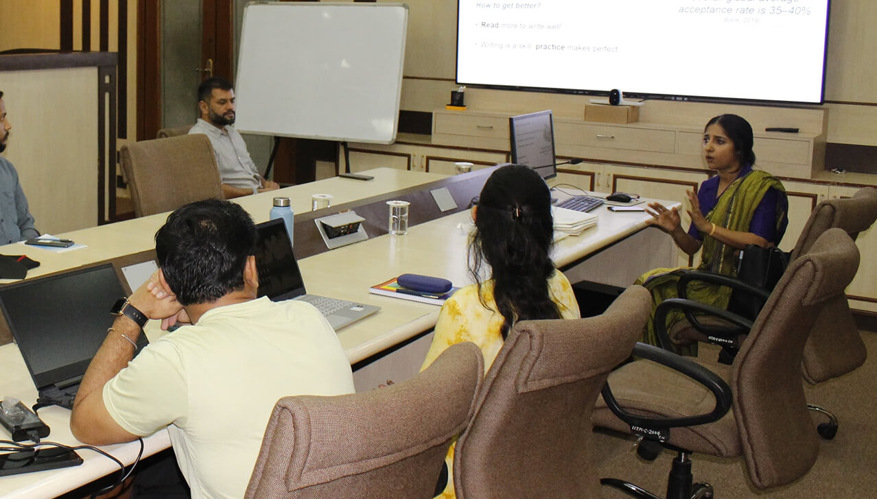 A researcher presenting during a workshop